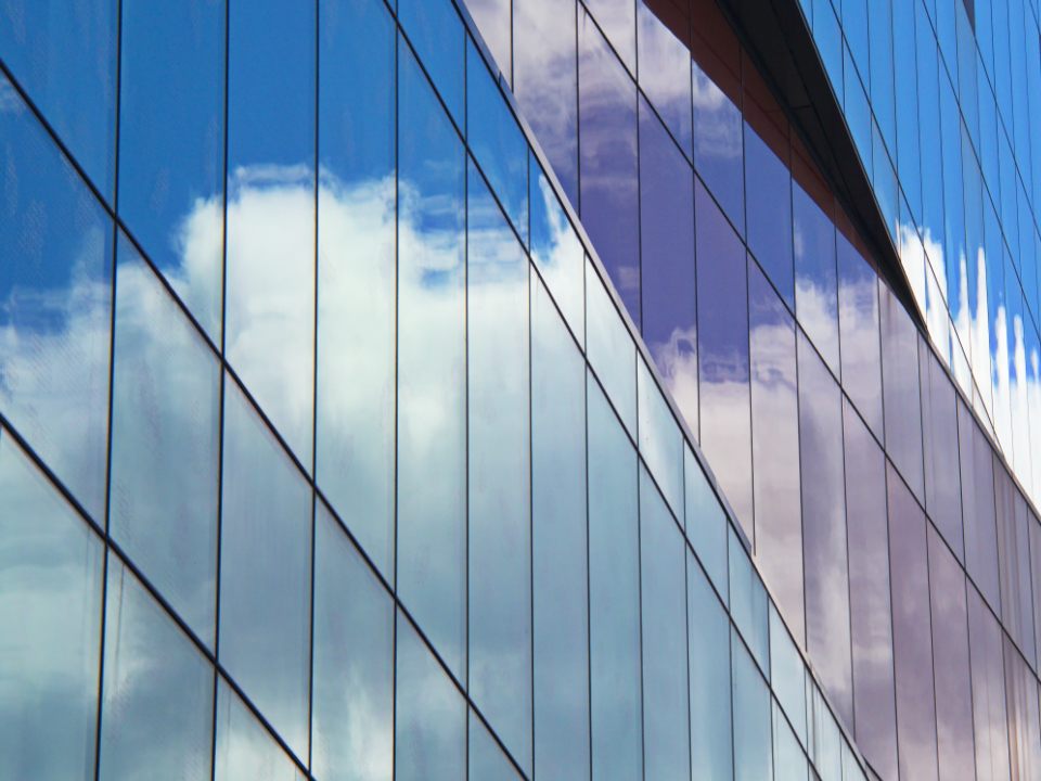 Storefront glazing at the base of a mixed-use building