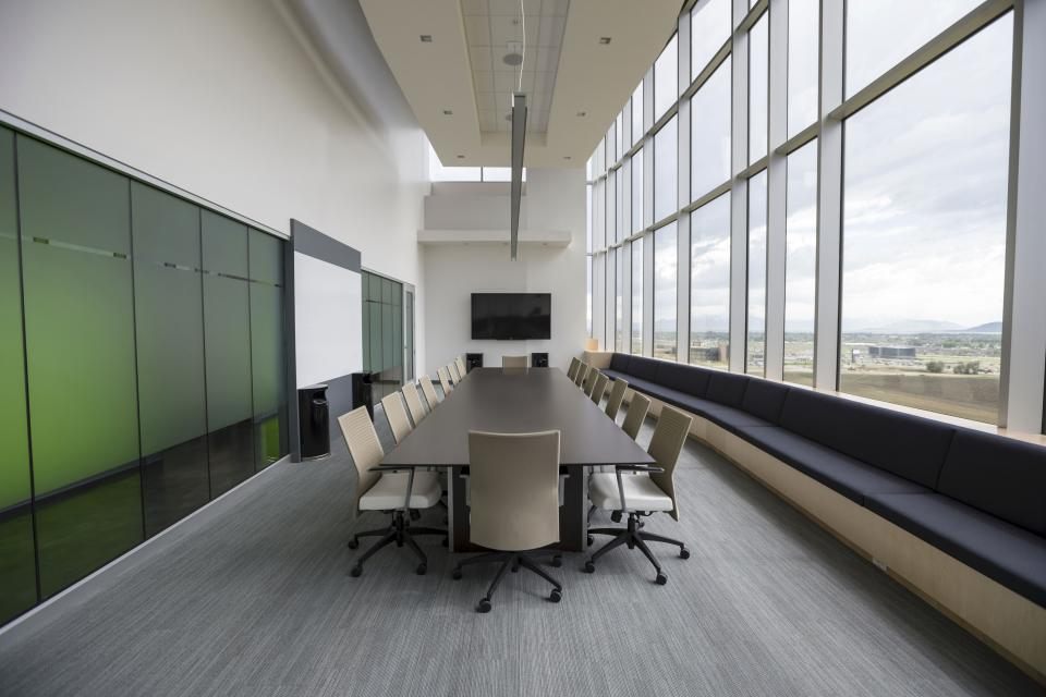 Glass conference room with full height walls